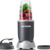 Nutribullet 600W personal smoothie blender in dark gray sitting on a modern kitchen countertop.
