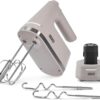 Dash Cordless Hand Mixer in elegant French Grey shown on its charging stand
