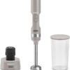 Dash cordless immersion blender in French Grey resting on its sleek matching charging stand