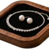 Close up of the 3.7 x 3.7 inch walnut wooden jewelry tray showing the soft black velvet interior.