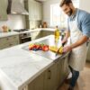 Close-up of the stainless steel cutting board L-shaped lip designed for secure grip on kitchen countertops.