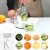 The Cambom manual food processor showing the suction cup base attached to a marble countertop