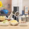 User-friendly rotary cheese grater demonstrating the secure suction cup base for stable, slip-resistant operation on countertops.