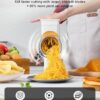 A user operating the GDL rotary cheese grater hand crank to quickly shred hard Parmesan cheese.