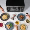 Interior view of the Farberware 1.1 cu ft countertop microwave featuring easy-clean walls and interior lighting.
