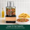 Close-up of the extra-large feed tube on this 14-cup food processor slicing whole vegetables