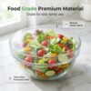 Top-down view of durable plastic food covers stretched securely over various sized plates and serving bowls.