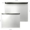 Professional stainless steel cutting board being used to chop vegetables on a modern kitchen workspace.