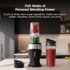 User blending a fresh fruit smoothie directly in the 16oz Nutri Ninja cup