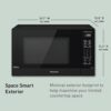 Panasonic compact inverter microwave in a modern kitchen setting saving counter space.