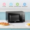 Interior view of the compact countertop microwave featuring the removable glass turntable.