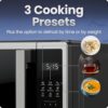Side profile showing the compact footprint of the Chefman 700W stainless steel microwave