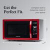 Interior view of the 1.1 cu ft countertop microwave highlighting the easy-clean cooking space and light.