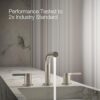 Detailed shot of the KOHLER Elate widespread bathroom sink faucet and metal touch-activated drain