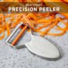 View of the Milk Street precision peeler featuring replaceable blades for long-lasting kitchen utility.
