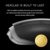 Side profile of a HexClad hybrid nonstick frying pan with a glass lid displaying the durable riveted handle design.