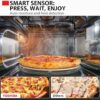 The Toshiba 4-in-1 microwave with air fryer showing the large capacity fitting a 12-inch pizza.