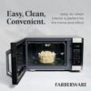 A family-sized 1.6 cu ft countertop microwave showcasing the child safety lock mechanism.