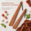 Set of two premium acacia wood spatulas resting on a kitchen countertop