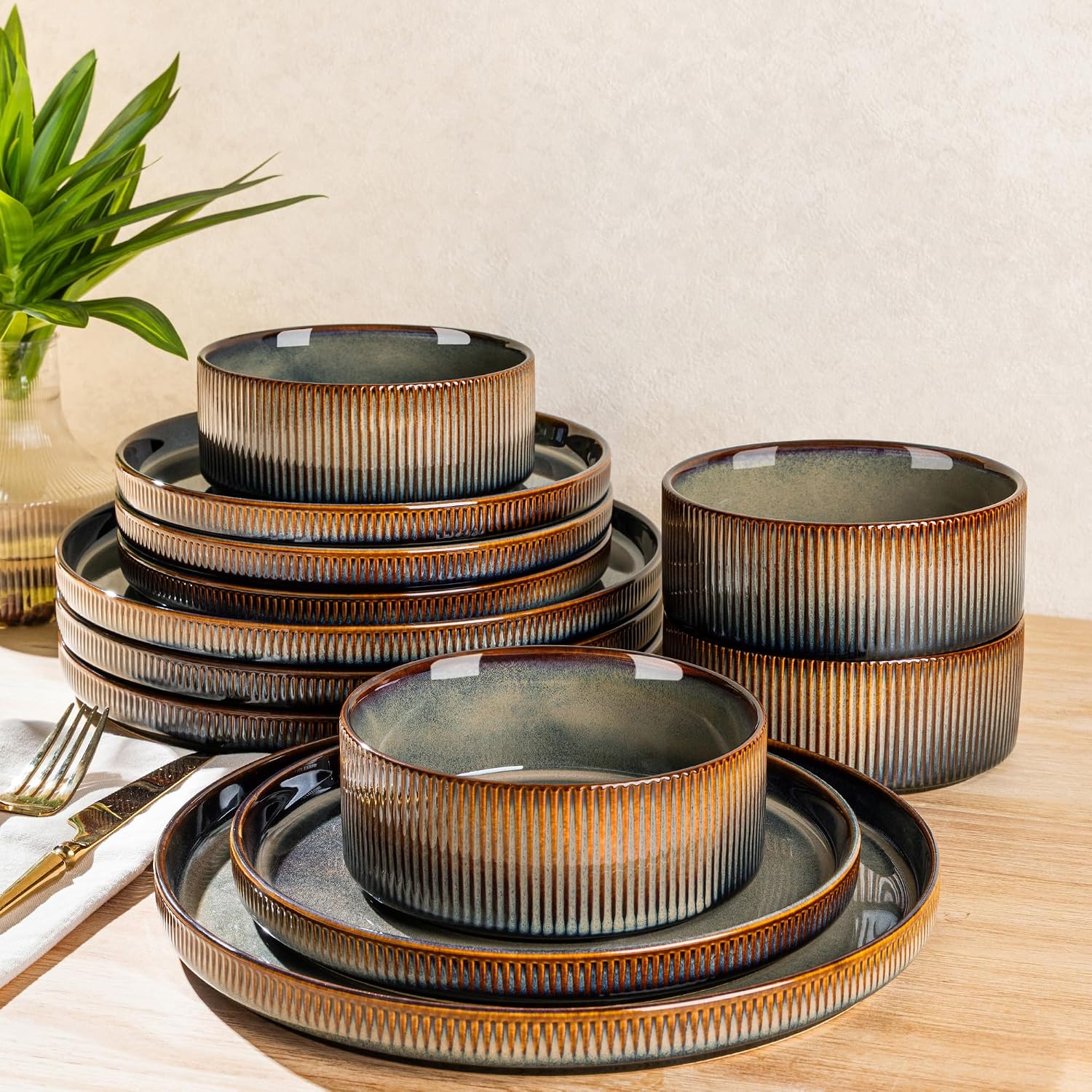 TheTerra 12-piece ceramic dinnerware set for 4 featuring unique handcrafted reactive glaze plates and bowls.