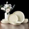 Full 24-piece AmorArc ceramic dinnerware set for 8 arranged on a modern dining table.