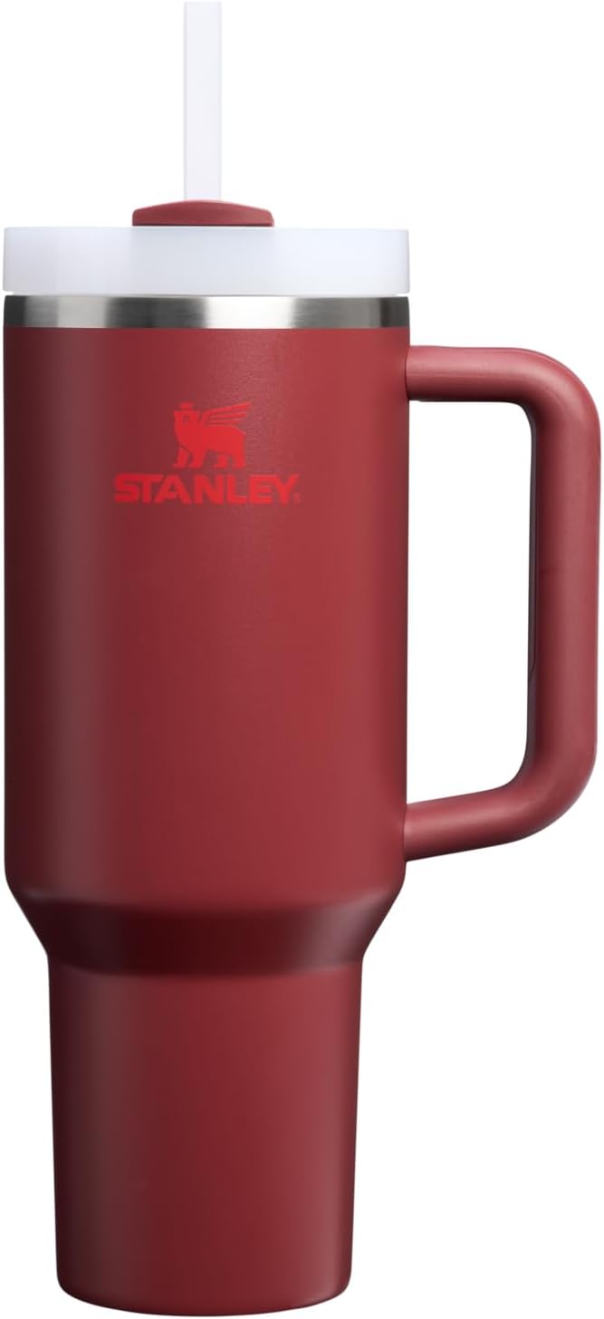 Full view of the 40 oz Stanley tumbler in a vibrant cranberry finish with its ergonomic comfort-grip handle.