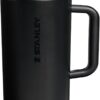 A sleek 64 oz Stanley tumbler in black with a modern Flipstraw lid design.