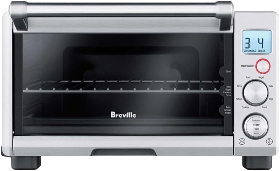 Front view of the Breville Compact Smart Toaster Oven featuring a brushed stainless steel finish.