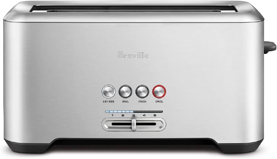 Front view of the Breville Bit More 4 slice stainless steel toaster in a modern kitchen setting.