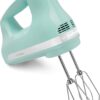 KitchenAid 5 speed hand mixer in Ice Blue shown from the front with stainless steel beaters attached.