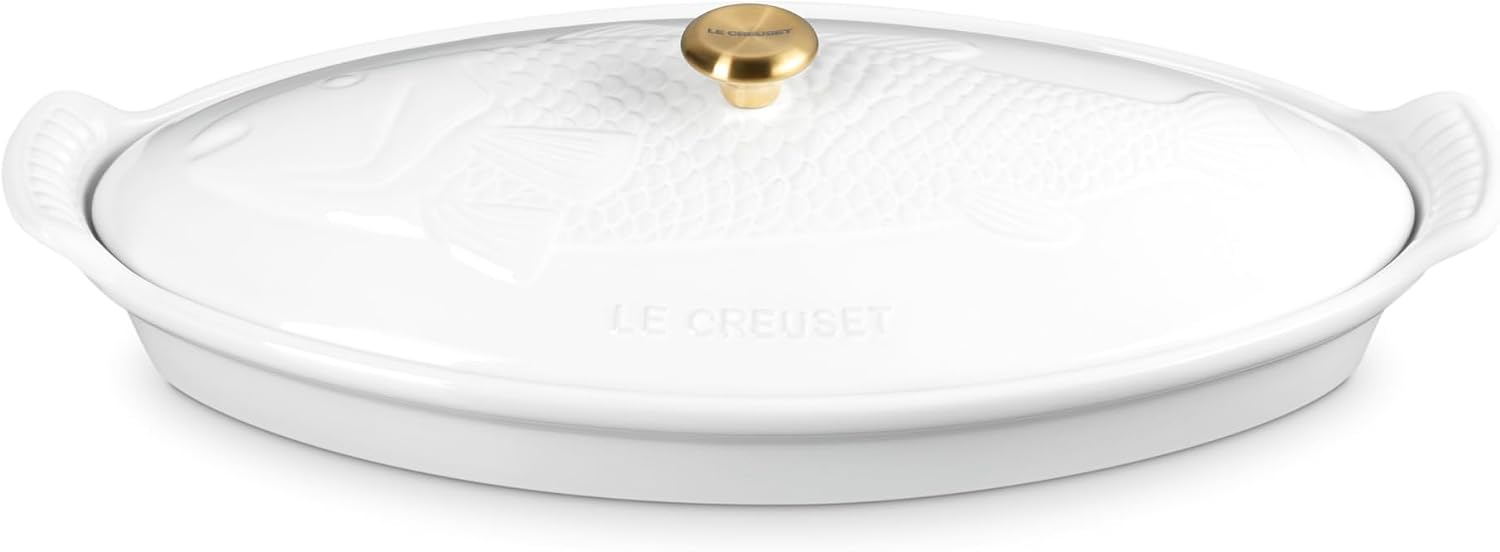 Le Creuset white stoneware fish baker with elegant embossed lid and gold knob