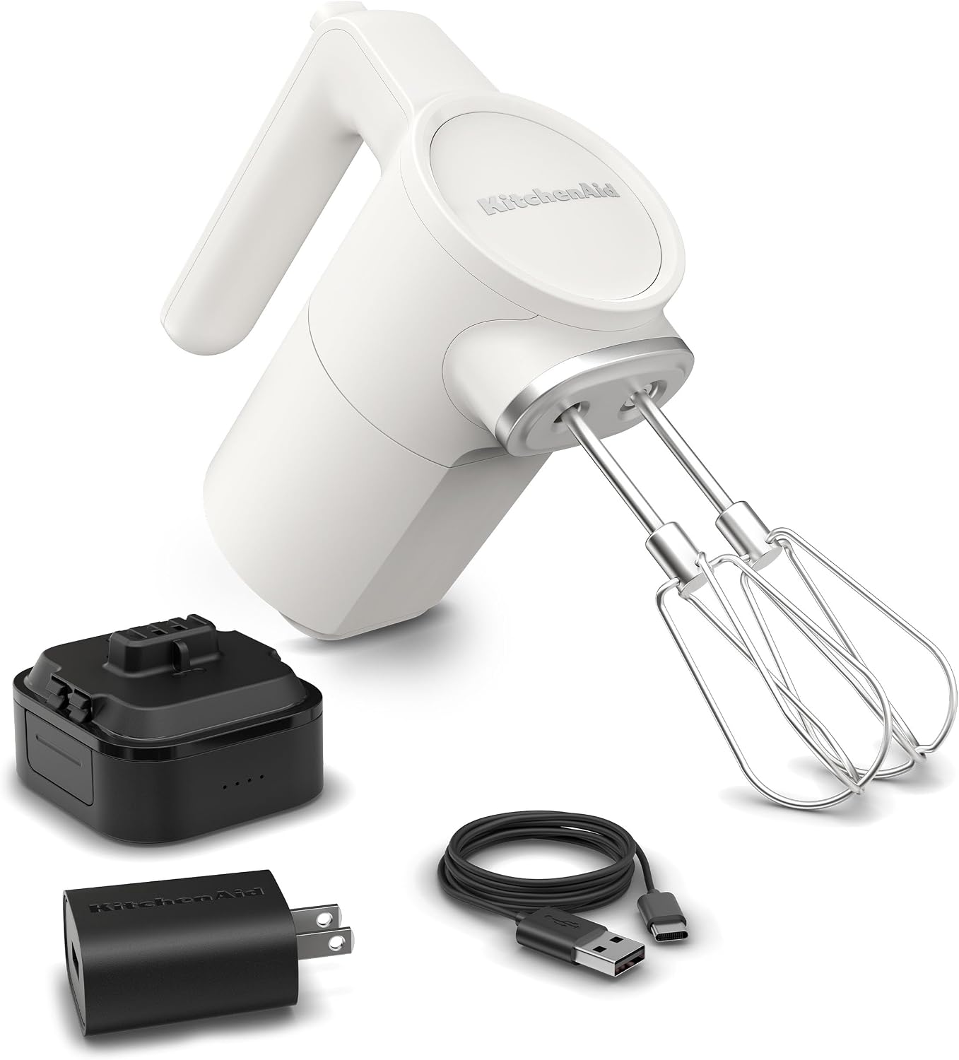 Porcelain White KitchenAid Go cordless hand mixer standing upright on a kitchen counter