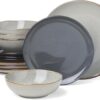 Full 12-piece Oneida Organic Shades gray stoneware dinnerware set arranged neatly on a dining table.