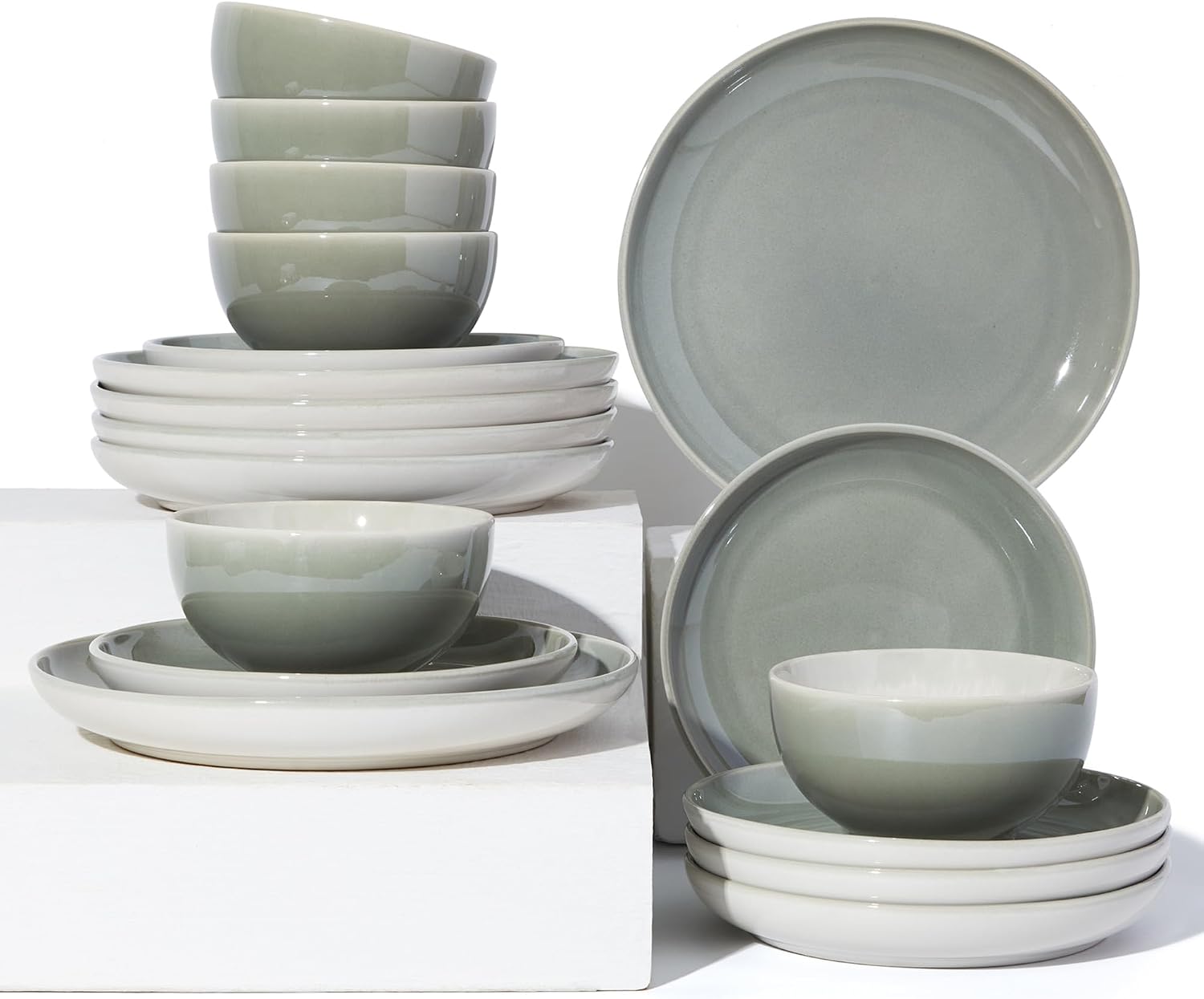 A full 18 piece stoneware dinnerware set from Pokini arranged on a dining table for six people.