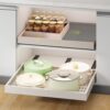 Detail view of the heavy-duty three-track rail system on the Fokyfok expandable pull out cabinet organizer.