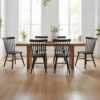 Close-up of the durable rubberwood construction and sturdy legs on a black Windsor dining chair.