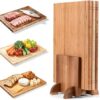 Three decorative book shaped cutting boards made from acacia, bamboo, and rubberwood