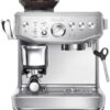 Close-up of the assisted tamping lever on the Breville Barista Express Impress for a professional barista twist finish.