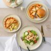 Stack of 8 soup bowls and salad plates from the AmorArc ceramic dinnerware set for 8.