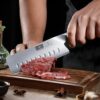 Ergonomic pakkawood handle of the HOSHANHO Nakiri knife designed for a comfortable, fatigue-reducing grip.