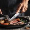 Ergonomic Pakkawood handle of the HOSHANHO steak knife designed for a secure, comfortable grip
