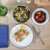 Versatile dinner bowls from the Gibson Home Oslo porcelain set filled with a pasta meal