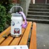 Side profile of the 64 oz insulated water jug featuring the sturdy integrated carry handle.