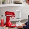 A freshly prepared bowl of fluffy shaved ice made using the KitchenAid shave ice attachment.