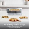 Detail shot of the Ninja flip toaster oven air fryer interface showing 8-in-1 cooking functions.