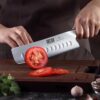 Ergonomic pakkawood handle of the HOSHANHO 7 inch nakiri knife for a comfortable grip