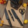 Close-up of the black coated stainless steel blades and textured non-slip handles in this 15-piece set.