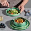 Top-down view of the 10-inch dinner plate and 8.3-inch pasta bowl from the green stoneware set