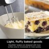 The hand mixer immersion blender combo attachment set including whisk, beaters, and blending arm arranged neatly.