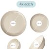 Deep pasta and soup bowls from the 16 piece stoneware dinnerware set arranged on a dining table.